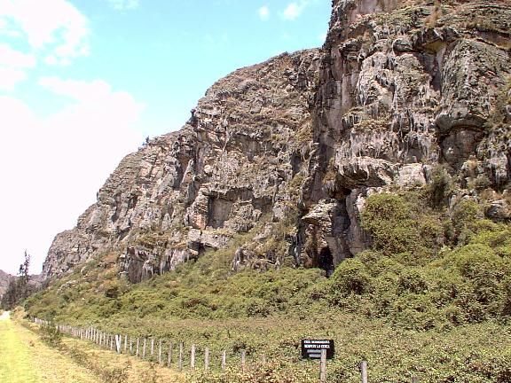 The sandstone wall of the Rocks, with a climber halfway up