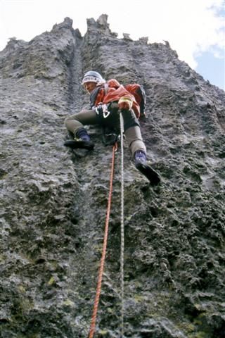 Rappel on a high mountain wall