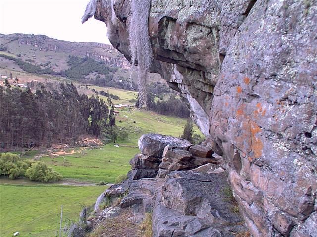 Climber on a roof at the Rocks with the valley behind